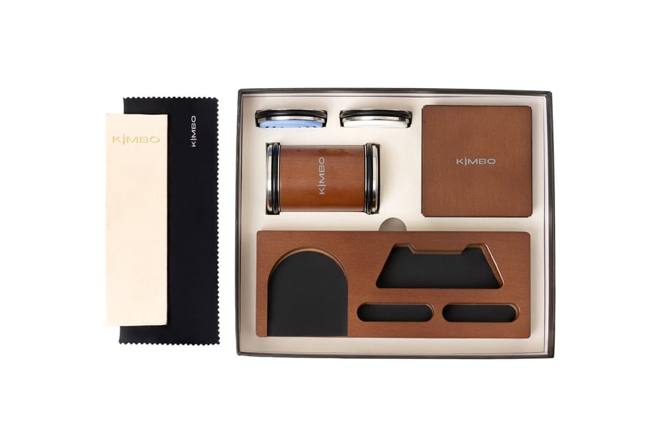 Kimbo Pro Kit laid out in its presentation box: rolling sharpener, angle block, whetstone discs, leather strop and microfibre cloth